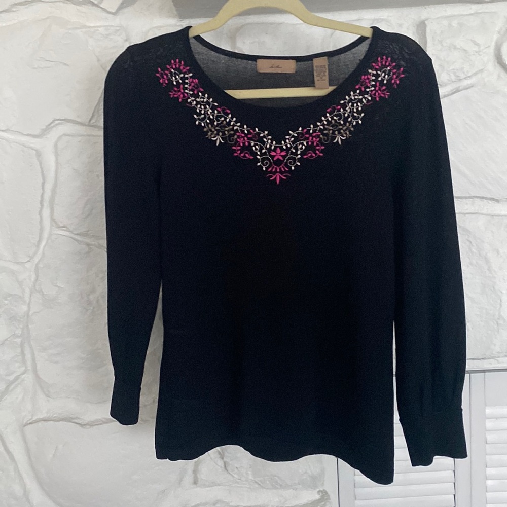 I E black top with pink and white embroidery around the neckline light weight